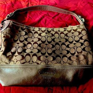 Chocolate brown coach canvas and leather tote bag.